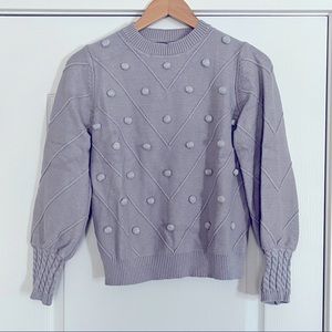 Gray sweater with puffed sleeves and geometric design. Medium